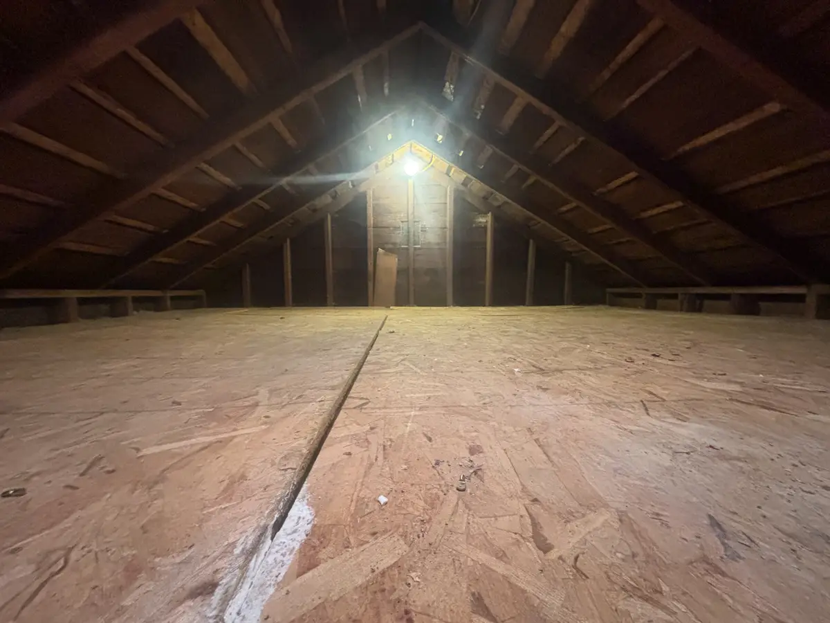 The same attic emptied and swept after the cleanout