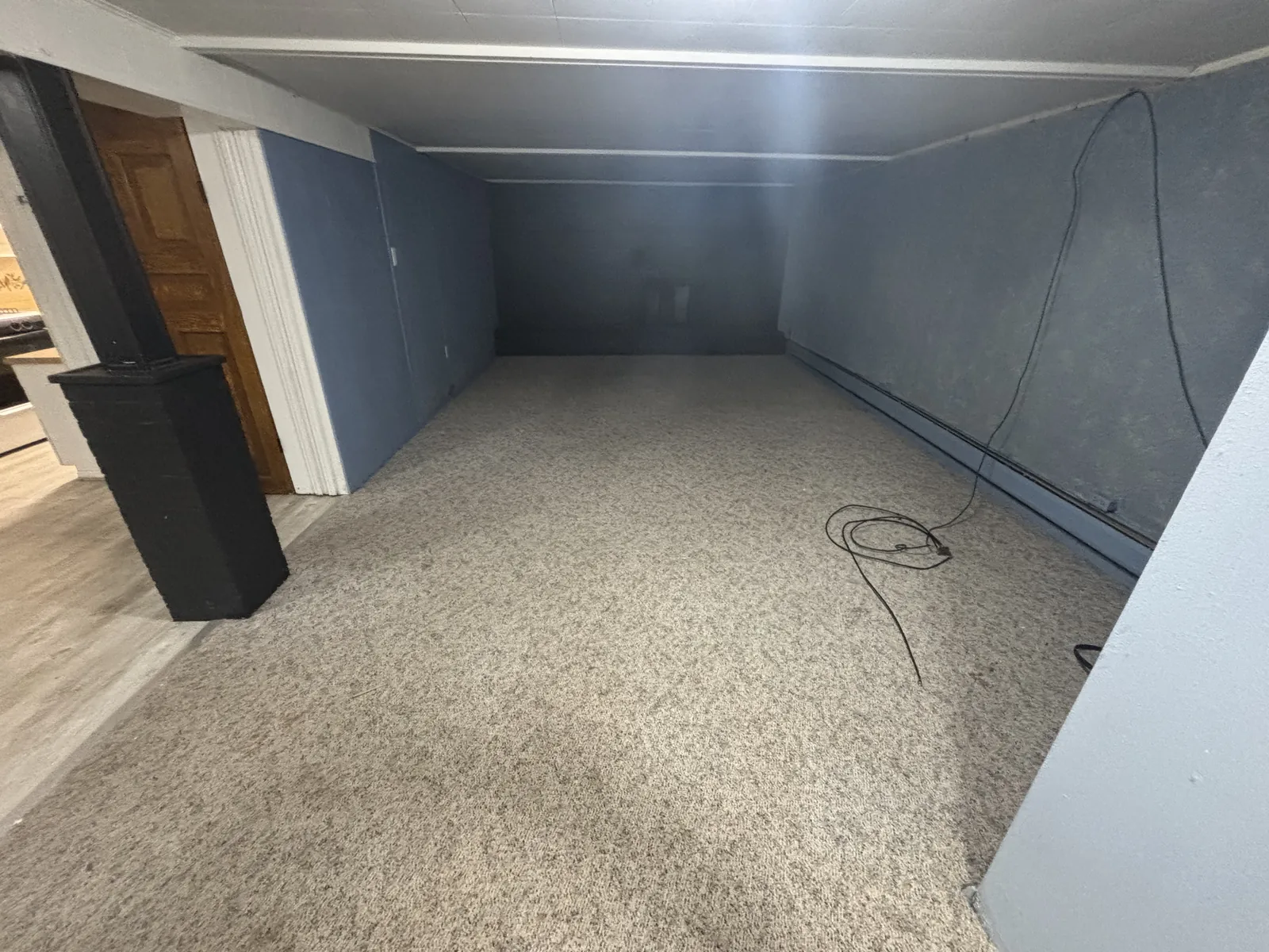 Finished basement emptied and swept after a cleanout