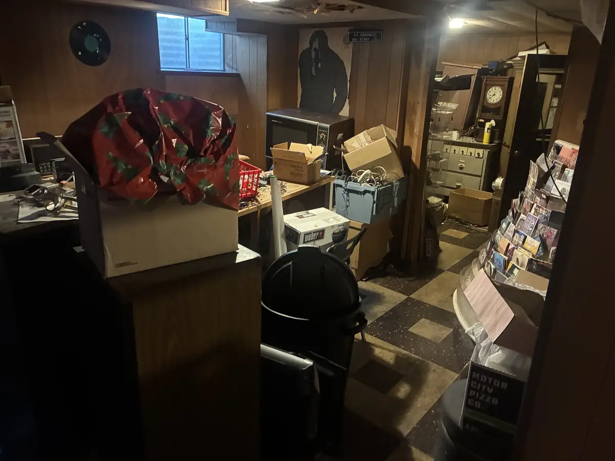 Cluttered space before cleanout by Michigan Cleanout C.R.E.W.