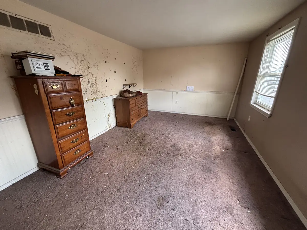 Bedroom cleared and cleaned after a hoarding cleanup