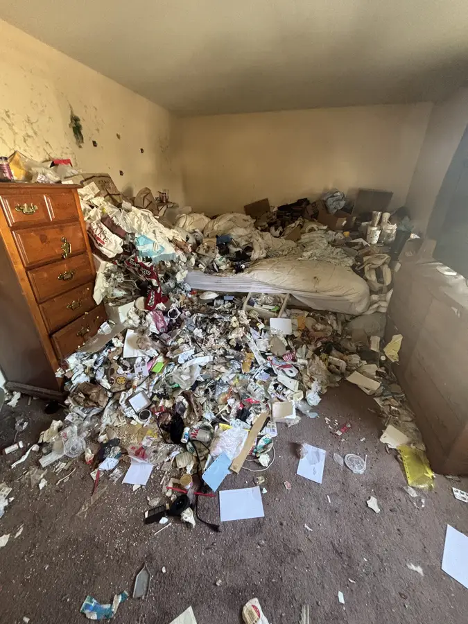 Cluttered space before cleanout by Michigan Cleanout C.R.E.W.