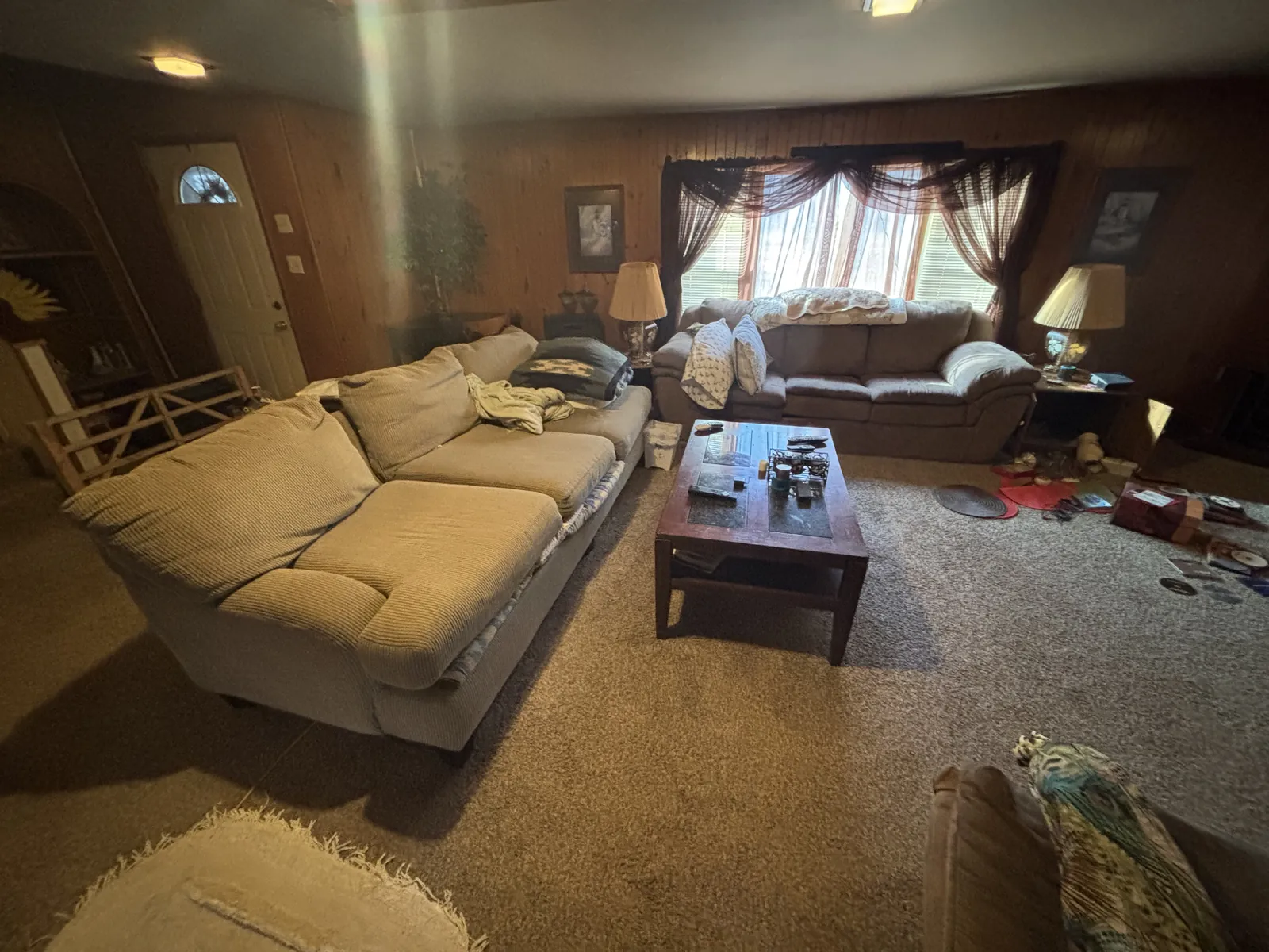 A furnished living room before the pre-listing cleanout