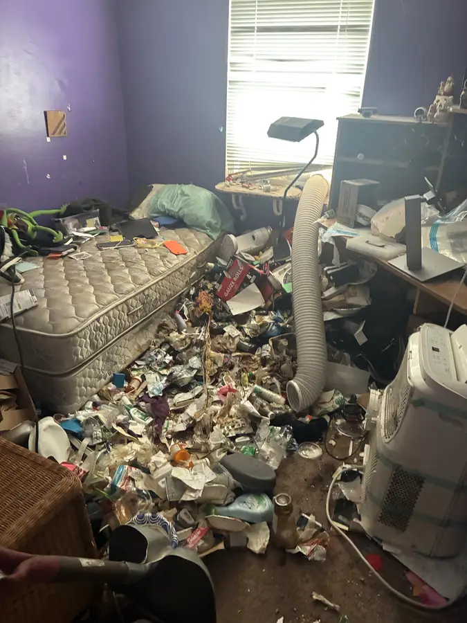 Cluttered space before cleanout by Michigan Cleanout C.R.E.W.